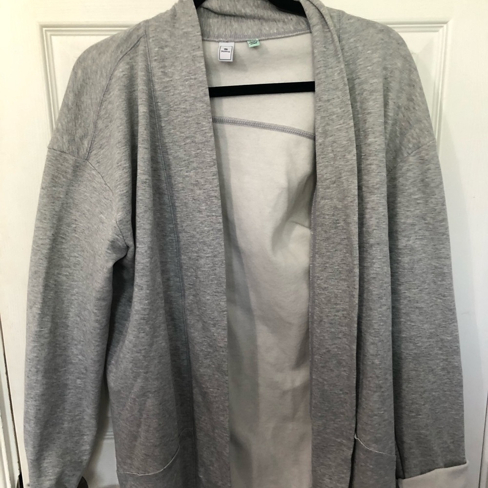 Woman’s light gray jacket